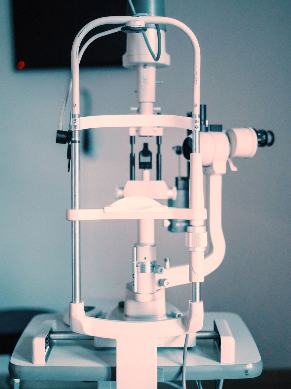 A slit lamp in an ophthalmology office, seen from the front.
